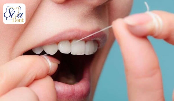 تاثیر نخ دندان در بوی بد دهان
